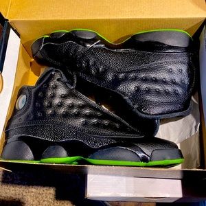 Like brand new Jordan 13s black and altitude green